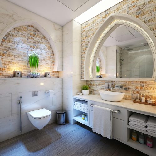 Elegant modern bathroom with marble tiles, ambient lighting, and stylish decor.